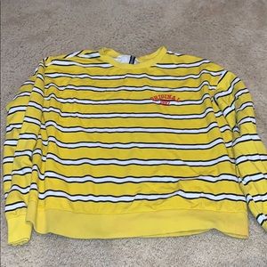 Yellow, white and black long sleeve. Red detailing